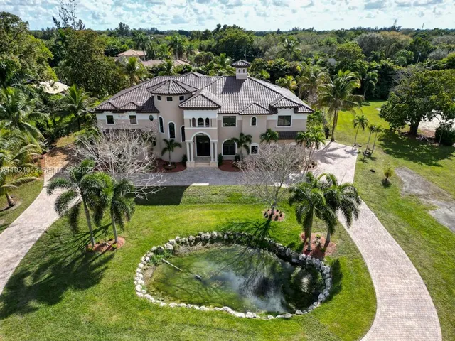 an aerial view of a house with a garden
