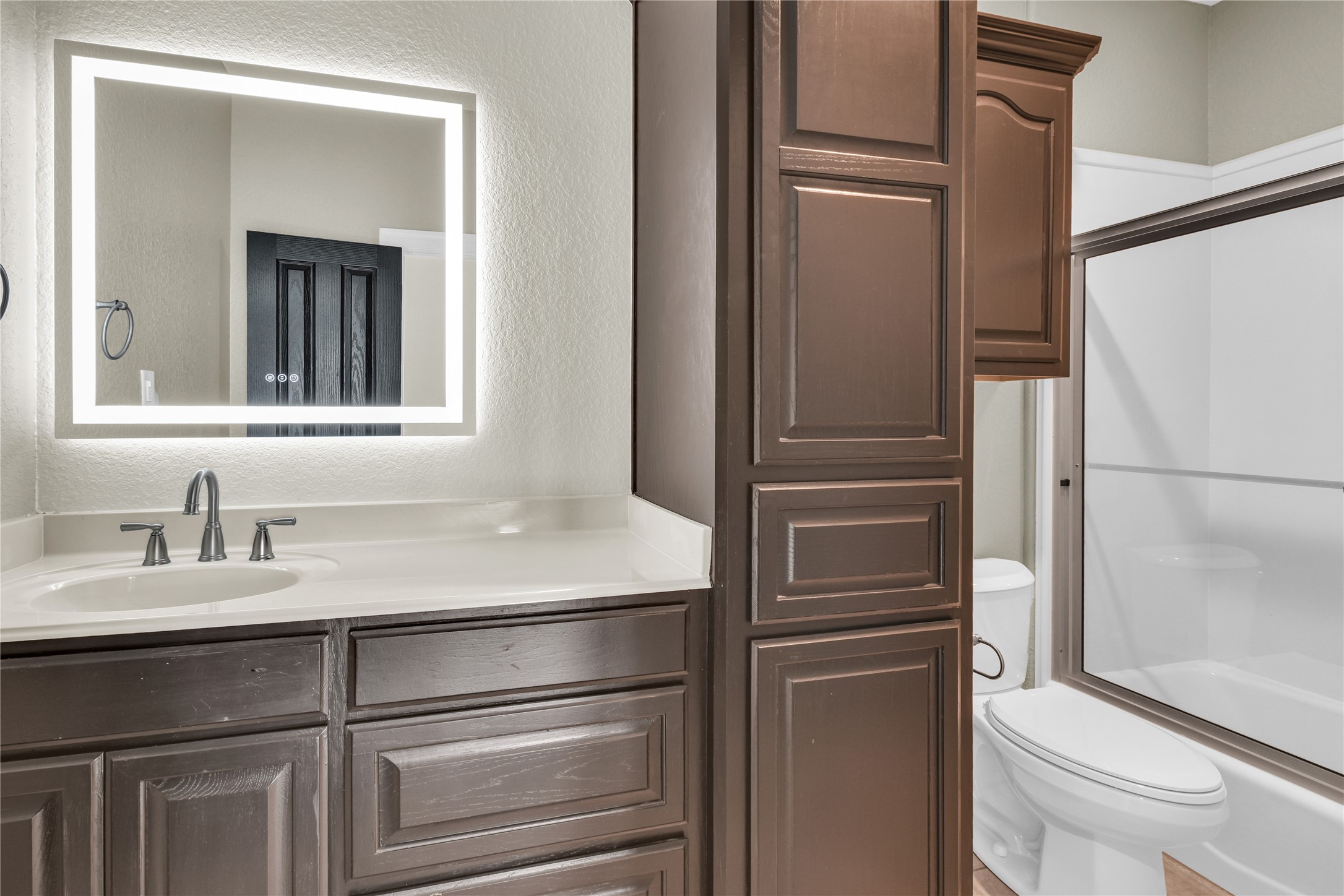 863 Bunkhouse Trail Angleton, TX 77515 - Photo 12 of 22 Full bathroom on the second floor with an illuminated mirror.
