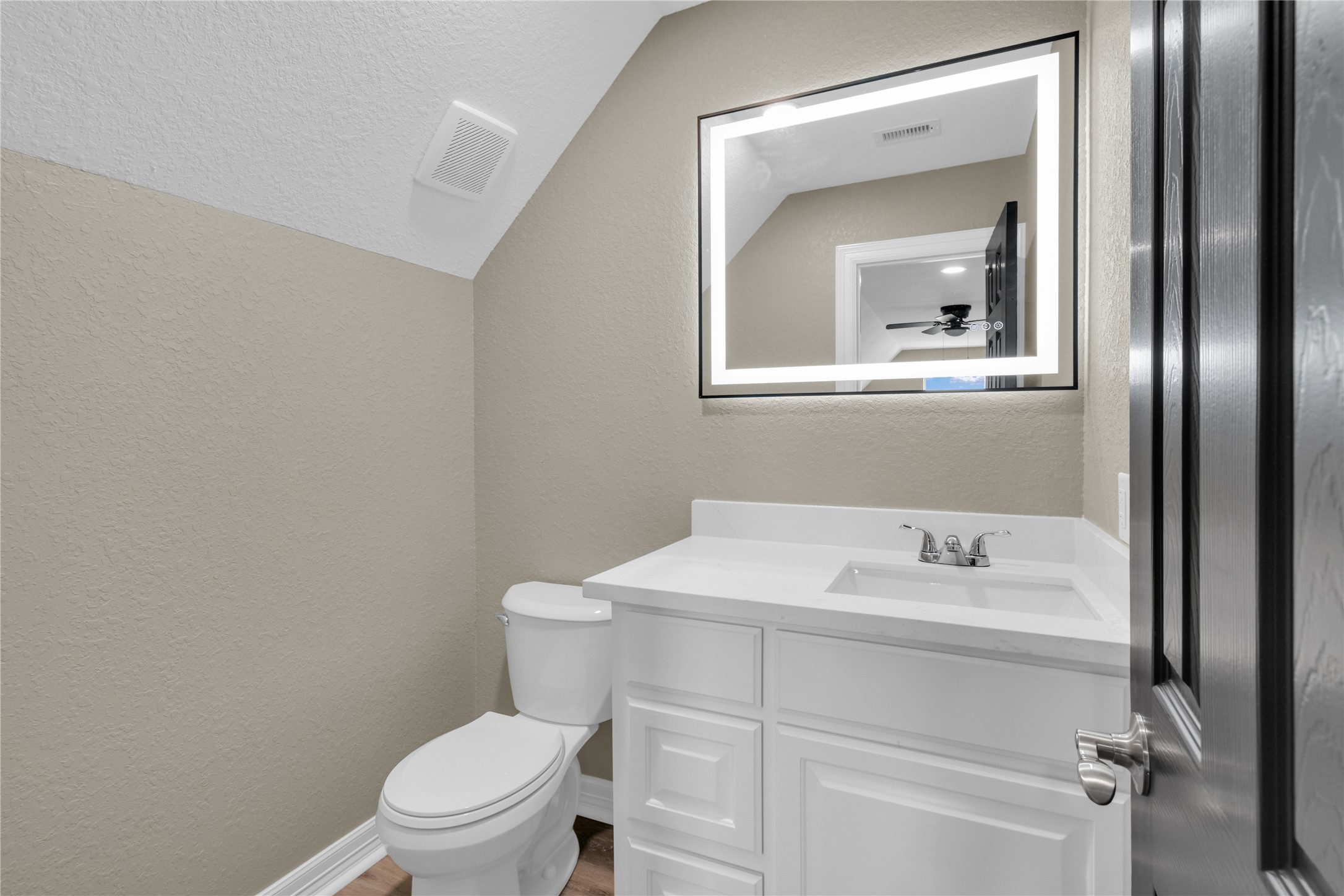 863 Bunkhouse Trail Angleton, TX 77515 - Photo 15 of 22 Guest suite bathroom with illuminated mirror