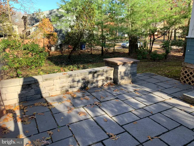 a view of a backyard with sitting area