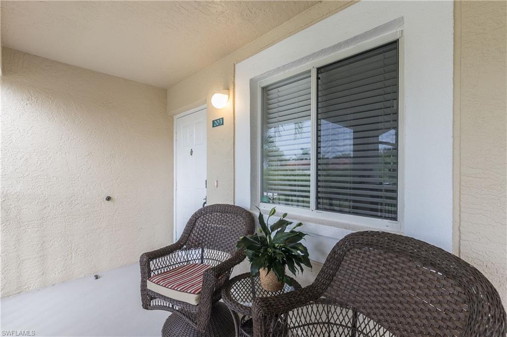 7766 Emerald Circle, Unit R203 Naples, FL 34109 - Photo 27 of 30 View of balcony