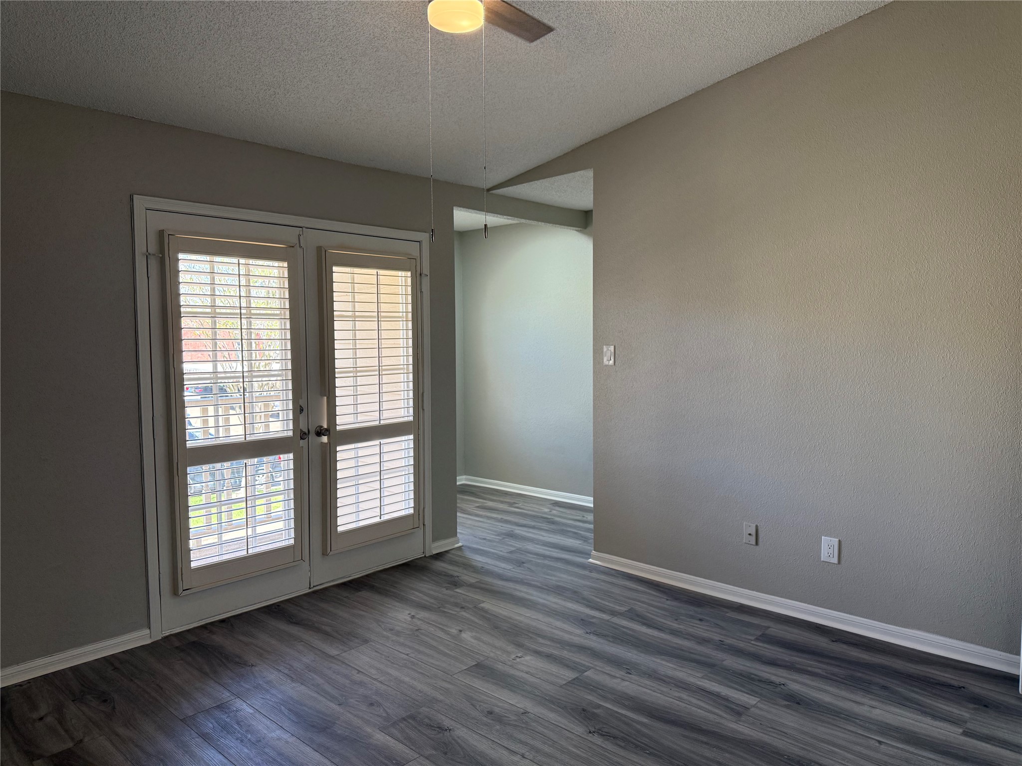 7575 Cambridge Street, Unit 2804 Houston, TX 77054 - Photo 19 of 38 a view of an empty room with wooden floor and a window