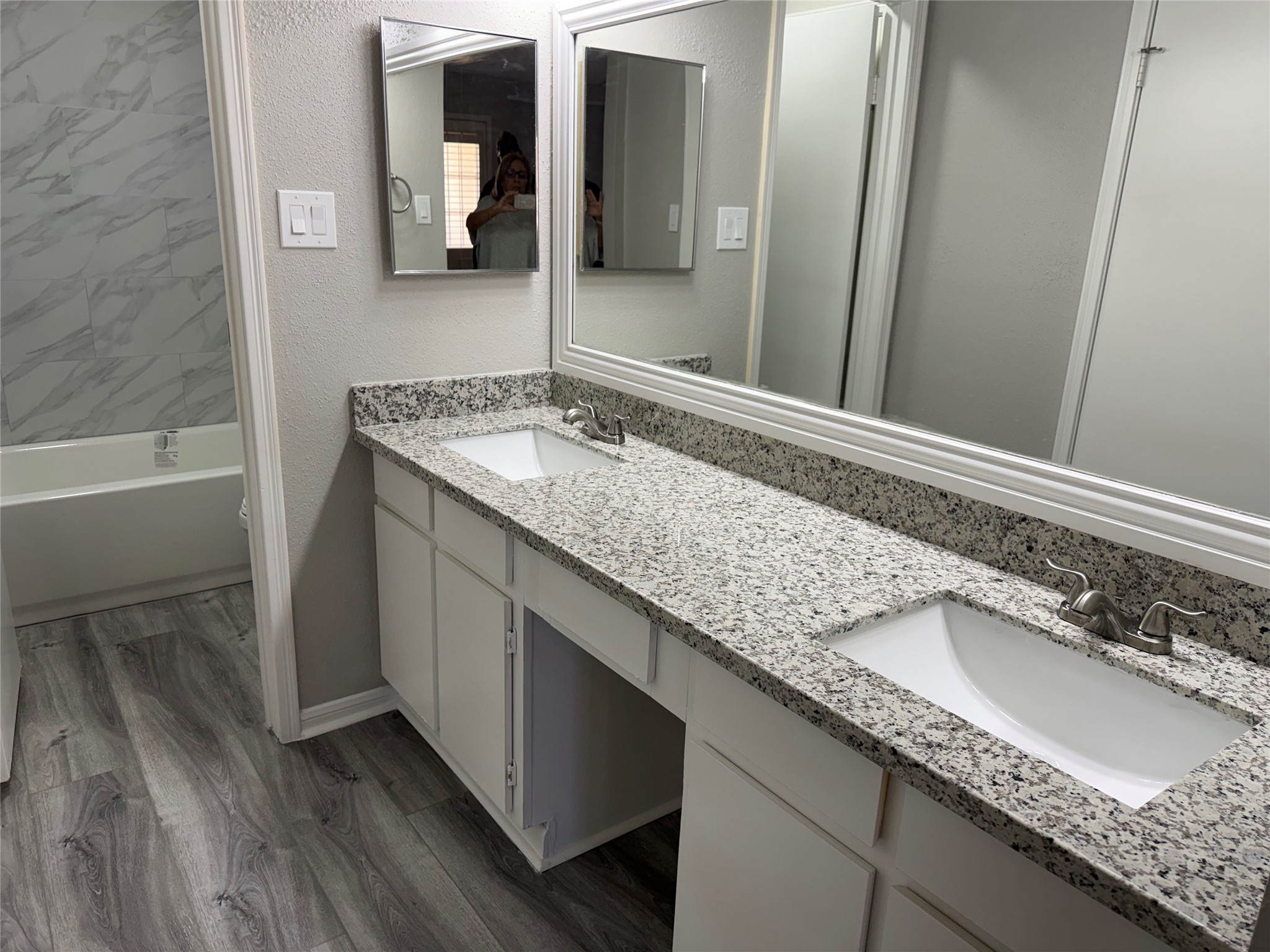 7575 Cambridge Street, Unit 2804 Houston, TX 77054 - Photo 24 of 38 a bathroom with a granite countertop sink and a mirror