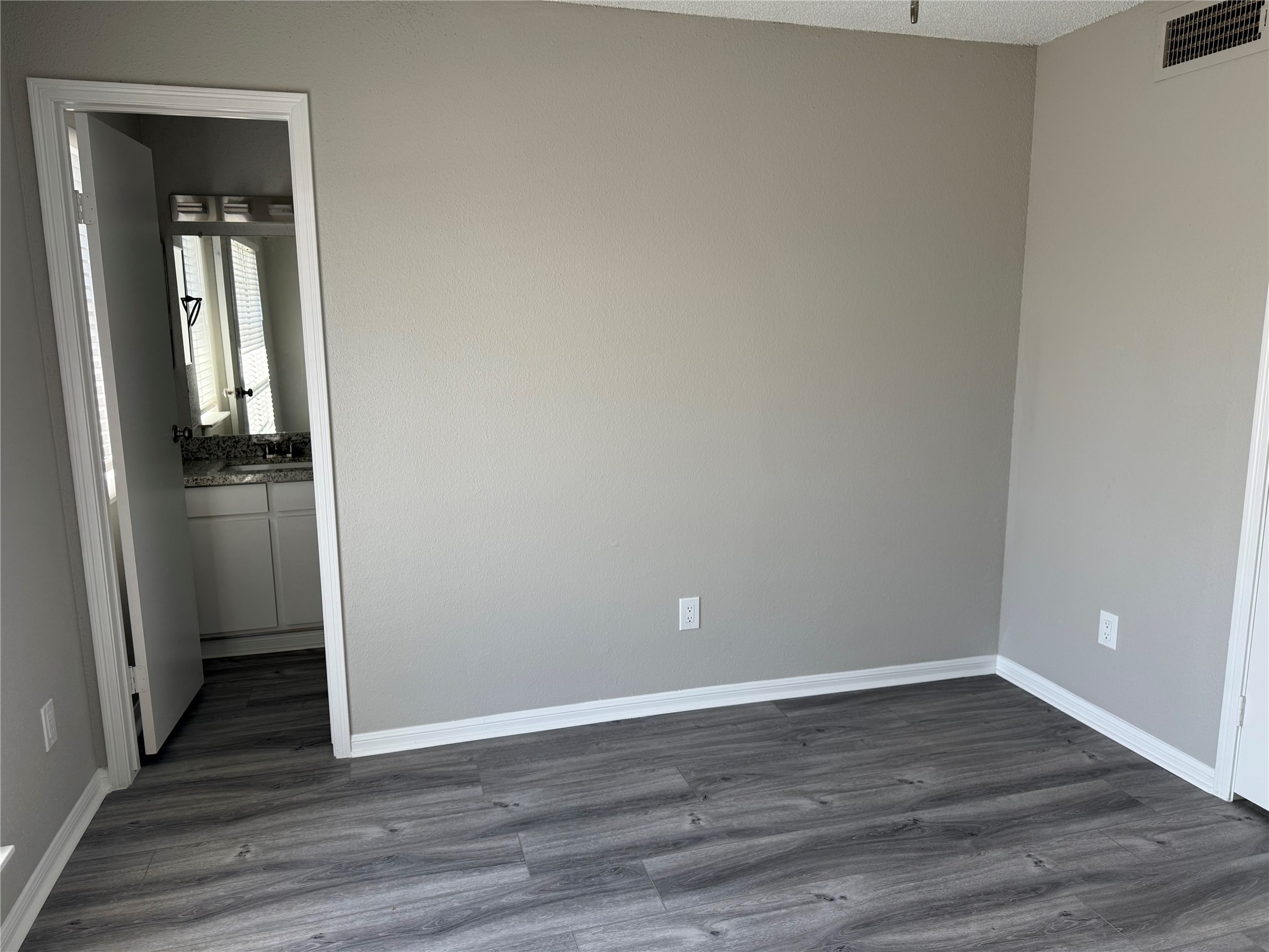 7575 Cambridge Street, Unit 2804 Houston, TX 77054 - Photo 30 of 38 a view of an empty room with wooden floor and closet