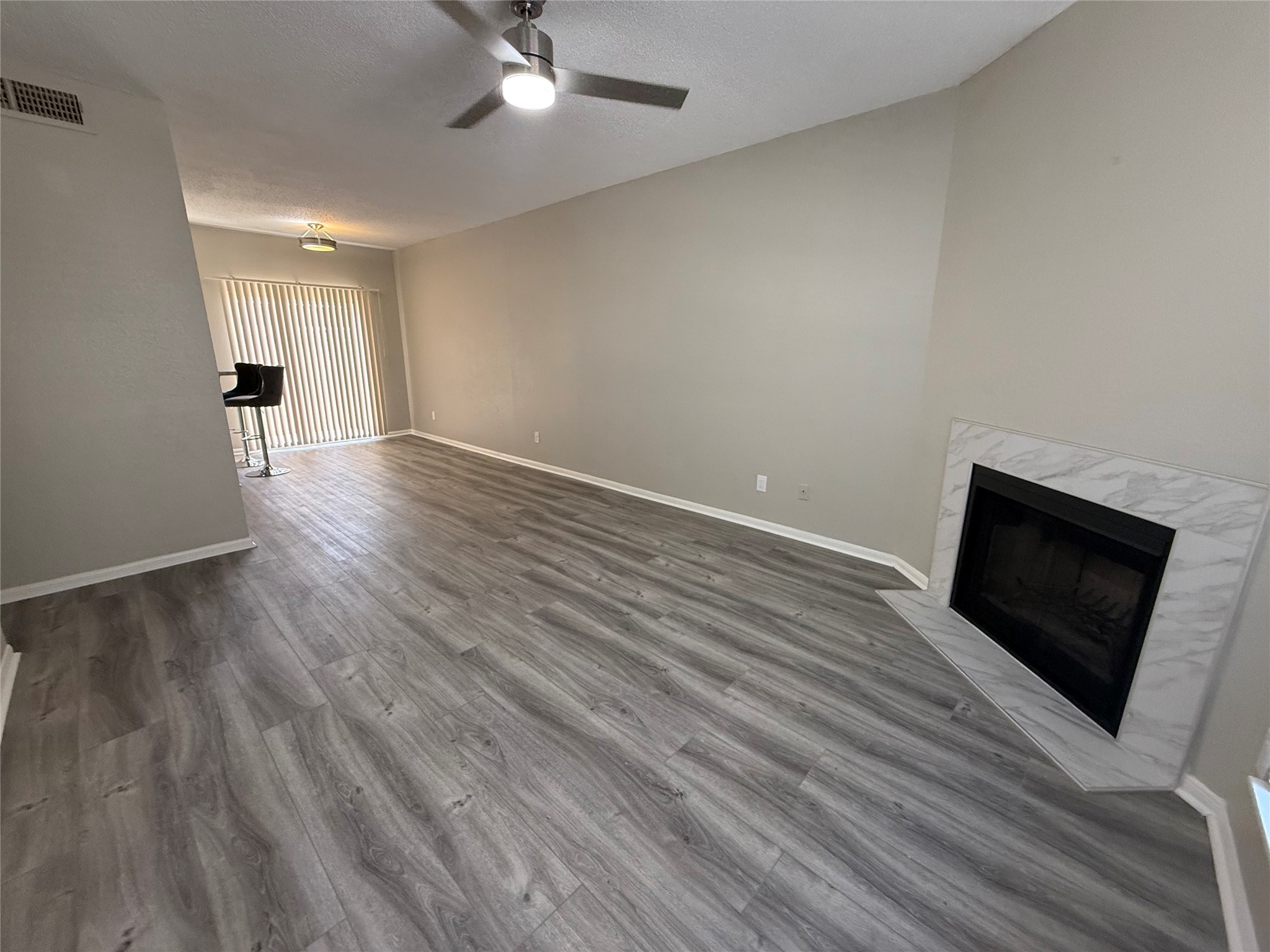 7575 Cambridge Street, Unit 2804 Houston, TX 77054 - Photo 5 of 38 a view of a livingroom with wooden floor and flat screen tv