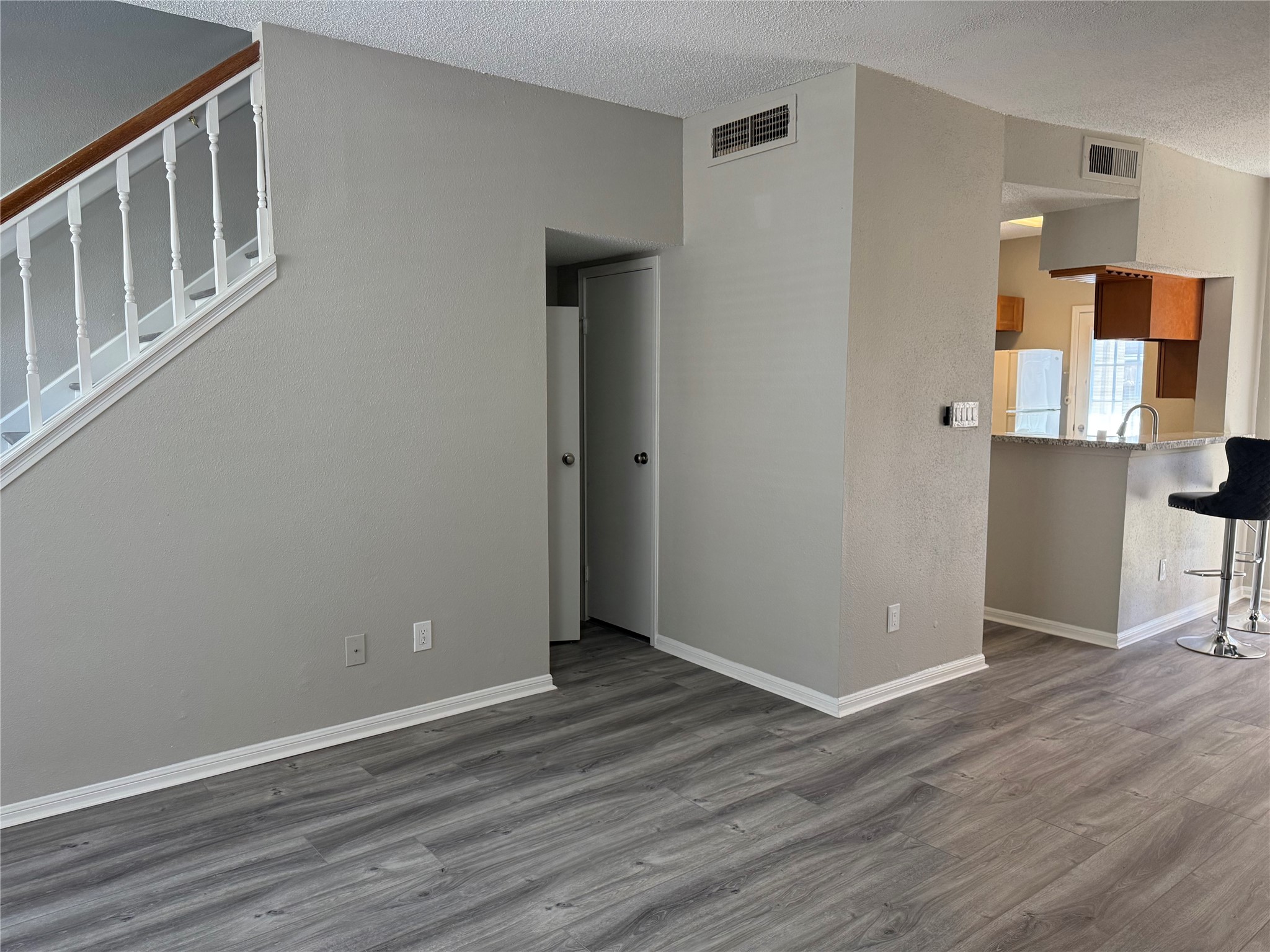 7575 Cambridge Street, Unit 2804 Houston, TX 77054 - Photo 8 of 38 a view of an empty room with wooden floor and a window