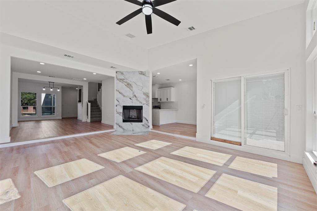 1412 North Crosspointe Street Duncanville, TX 75137 - Photo 3 of 24 a view of an empty room with a fireplace and a window