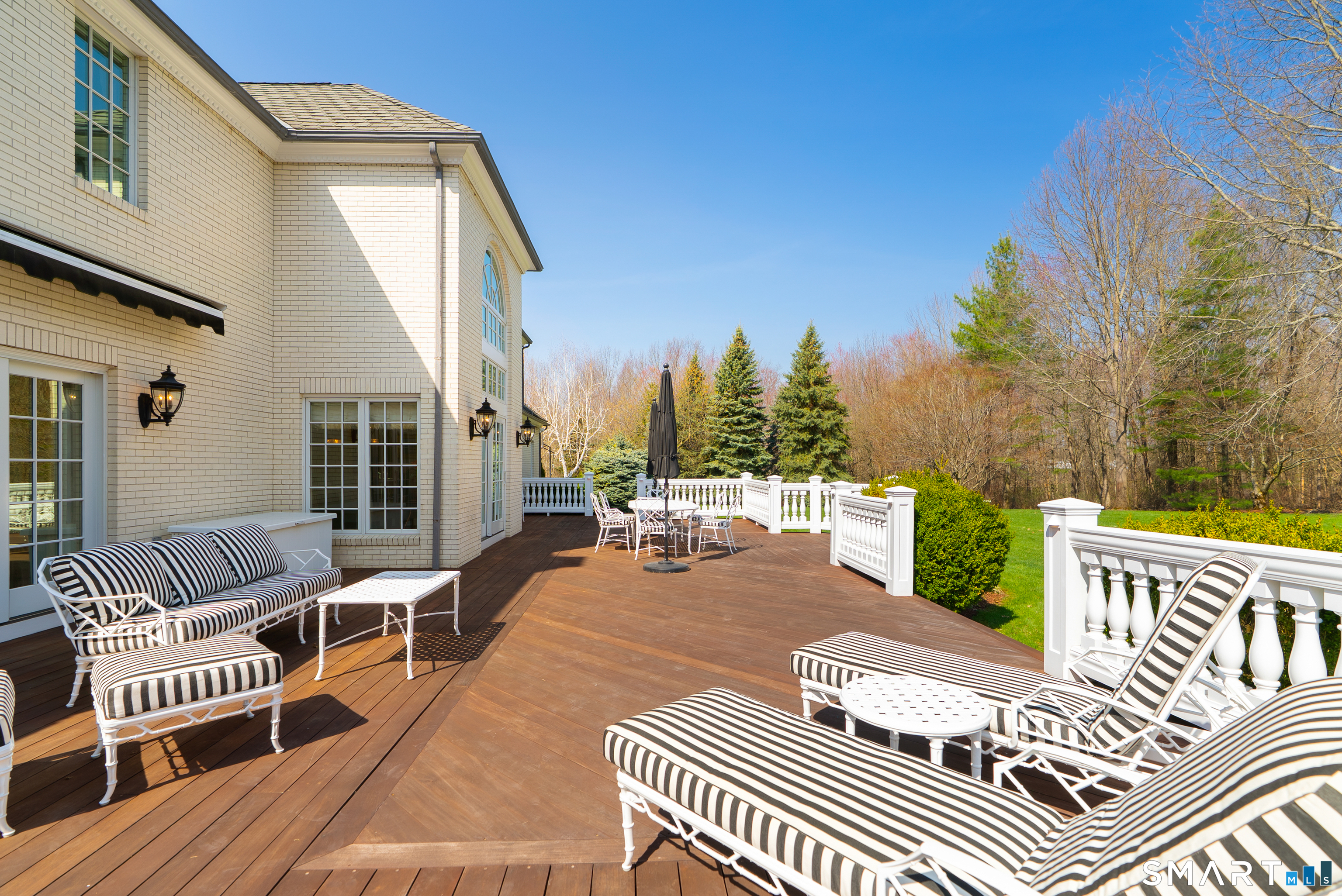 57 Thistledown Suffield, CT 06078 - Photo 33 of 39 a balcony with wooden floor and outdoor seating