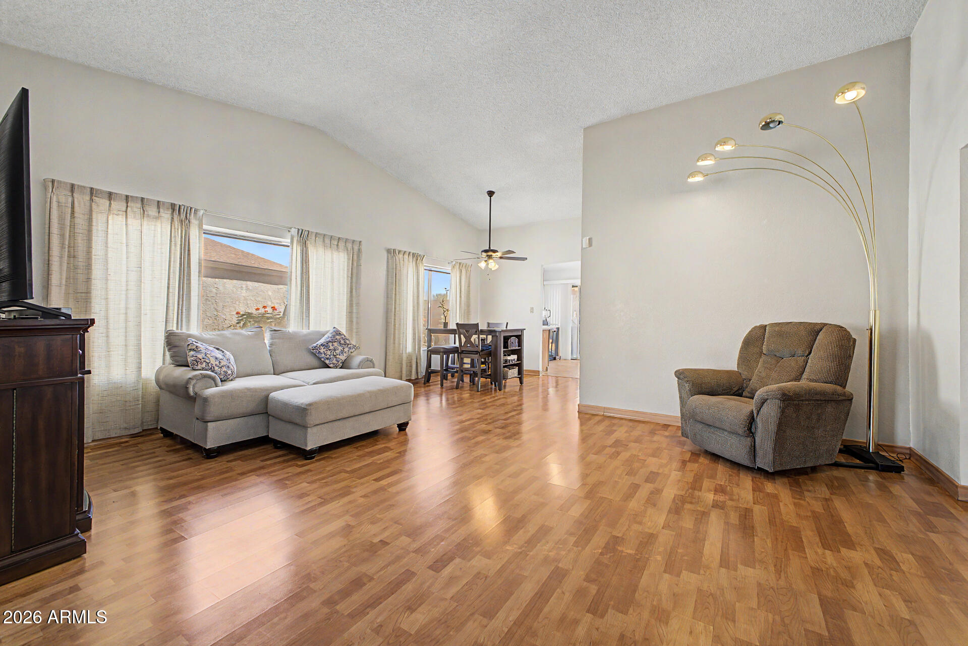 2659 West Hearn Road Phoenix, AZ 85023 - Photo 2 of 25 a living room with fireplace furniture and a wooden floor