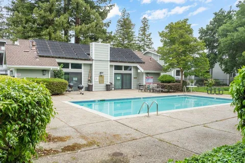 a view of house with a yard