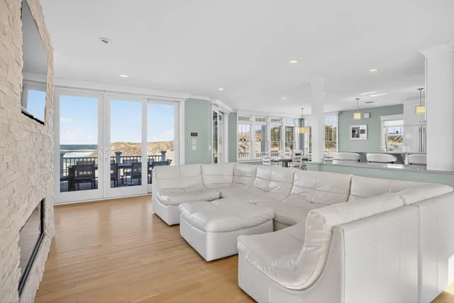 a view of a city from a dining room with furniture