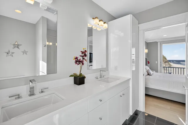 a view of a bedroom with wooden floor and balcony
