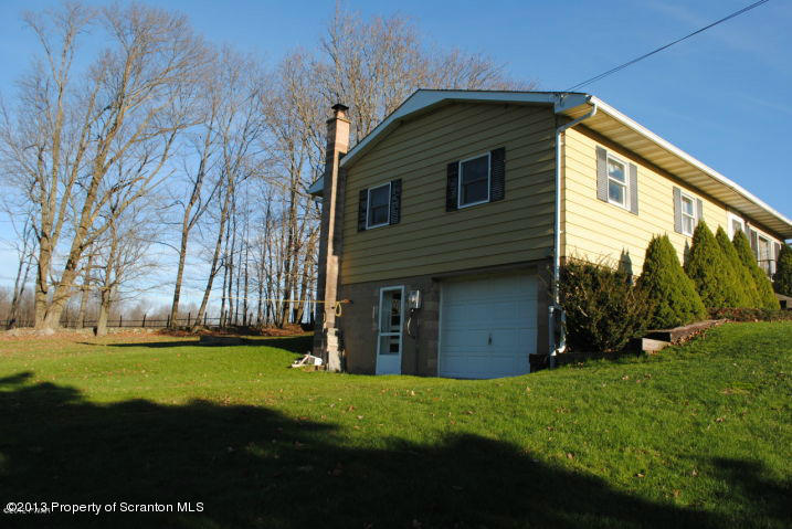 422 Gravity Hill Road Lake Ariel, PA 18436 - Photo 3 of 7 a view of a house with backyard and garden
