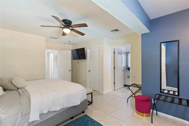 a bedroom with a bed and closet