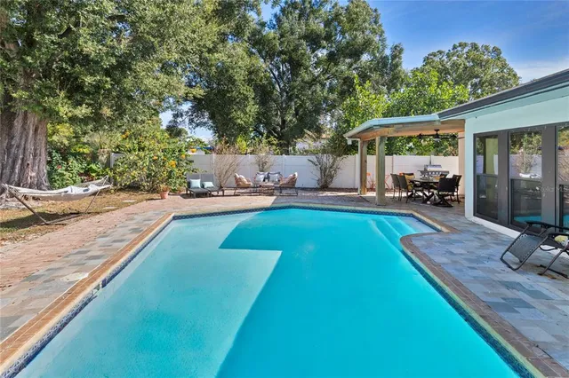 a view of a backyard with a patio