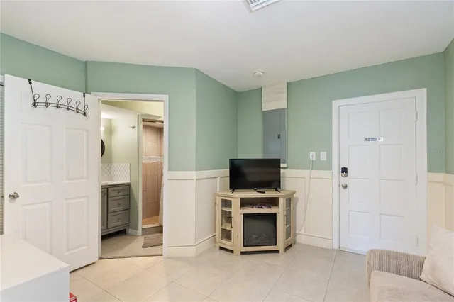 a view of a livingroom with furniture and a flat screen tv