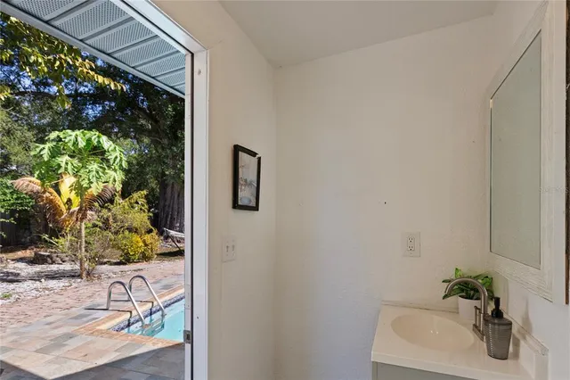 a bathroom with a sink and mirror