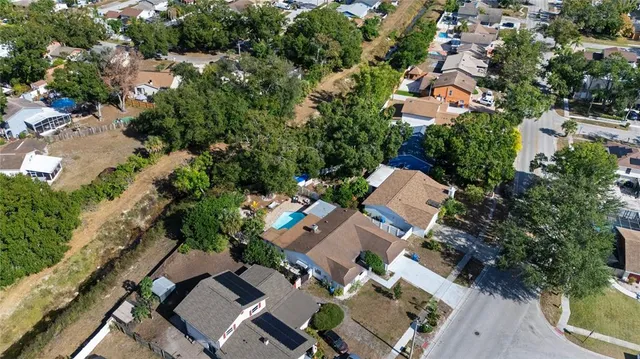 an aerial view of multiple houses with yard