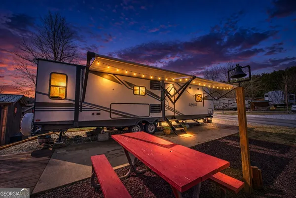 a view of a chairs and table in the patio
