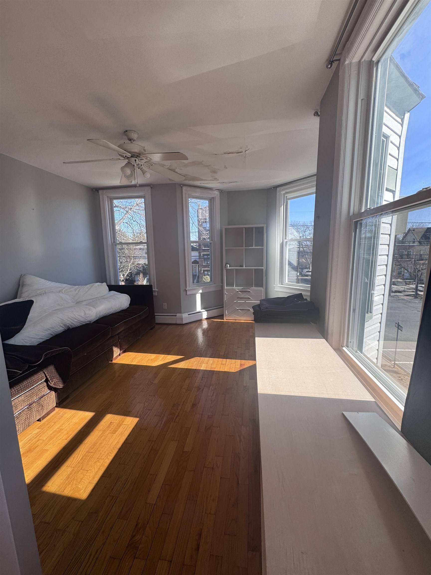 901 Avenue C, Unit 2 Bayonne, NJ 07002 - Photo 5 of 7 a view of a living room and dining room