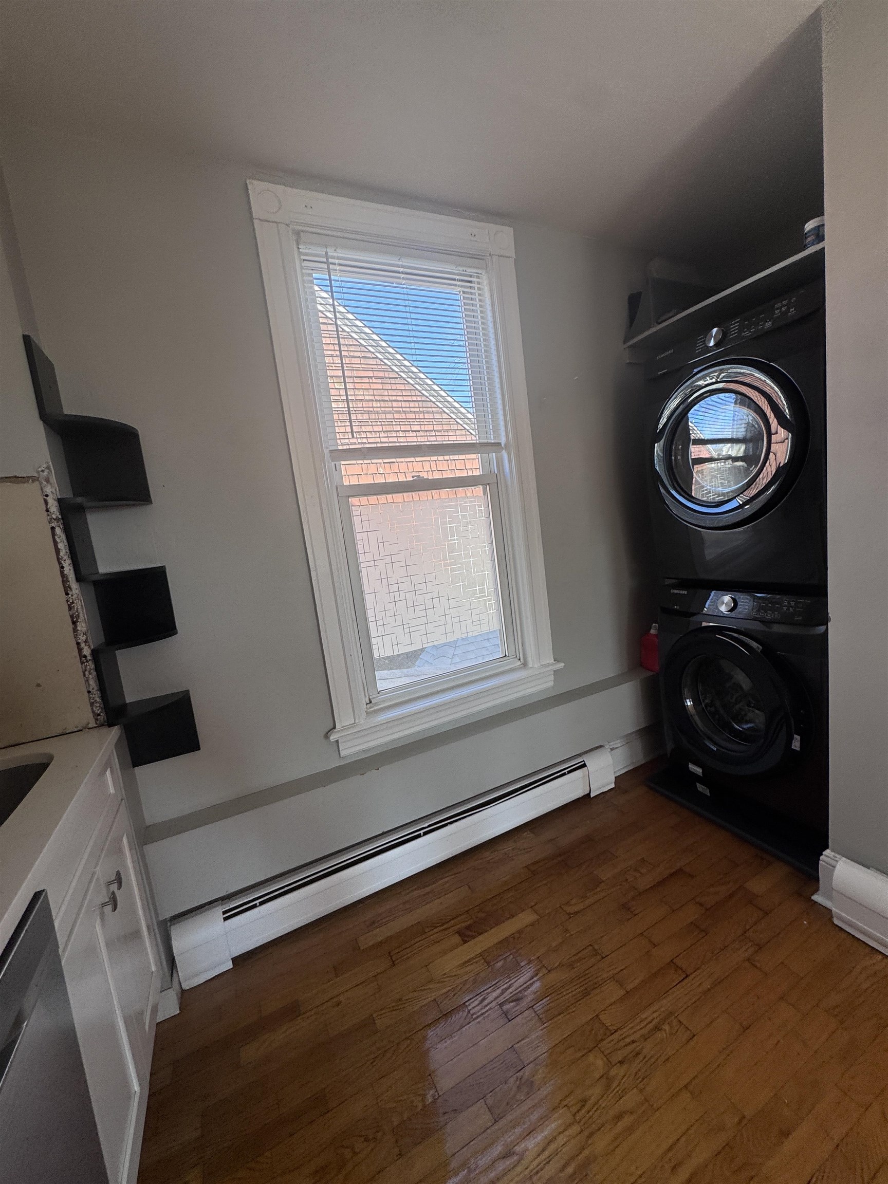 901 Avenue C, Unit 2 Bayonne, NJ 07002 - Photo 7 of 7 a view of a room with washer and dryer