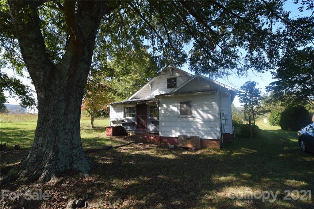 1051 Poors Ford Road Rutherfordton, NC 28139 - Photo 3 of 21 a view of a yard in front of a house with a large tree