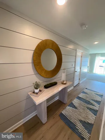 a bathroom with a sink mirror vanity and a toilet