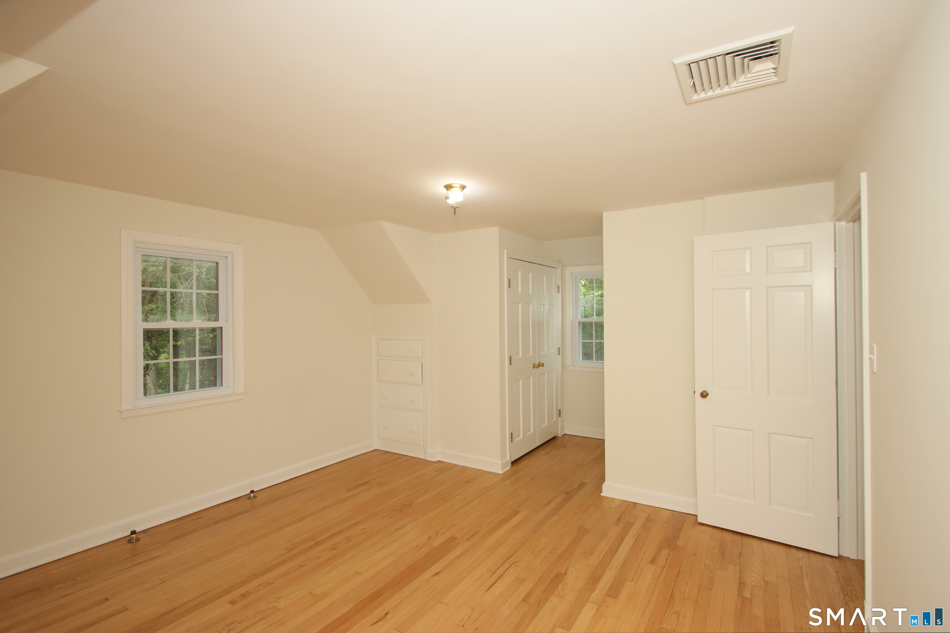 23 Norway Road North Haven, CT 06473 - Photo 23 of 32 an empty room with wooden floor and windows