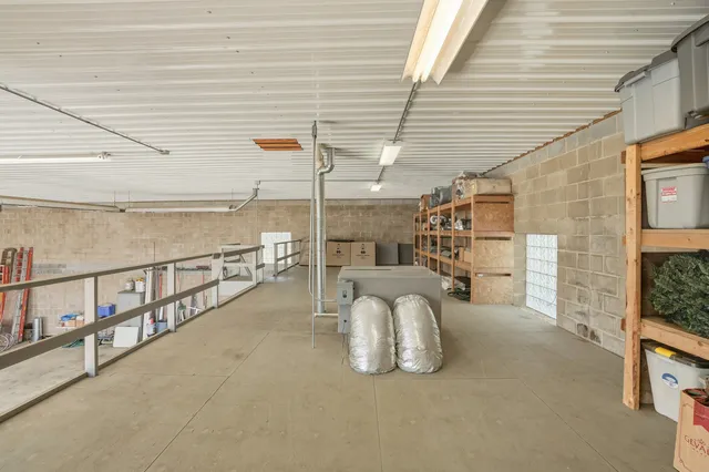 a view of a chairs and table in the balcony