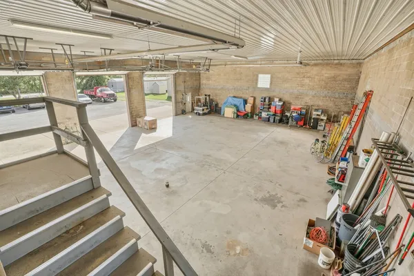 a view of a hallway with stairs
