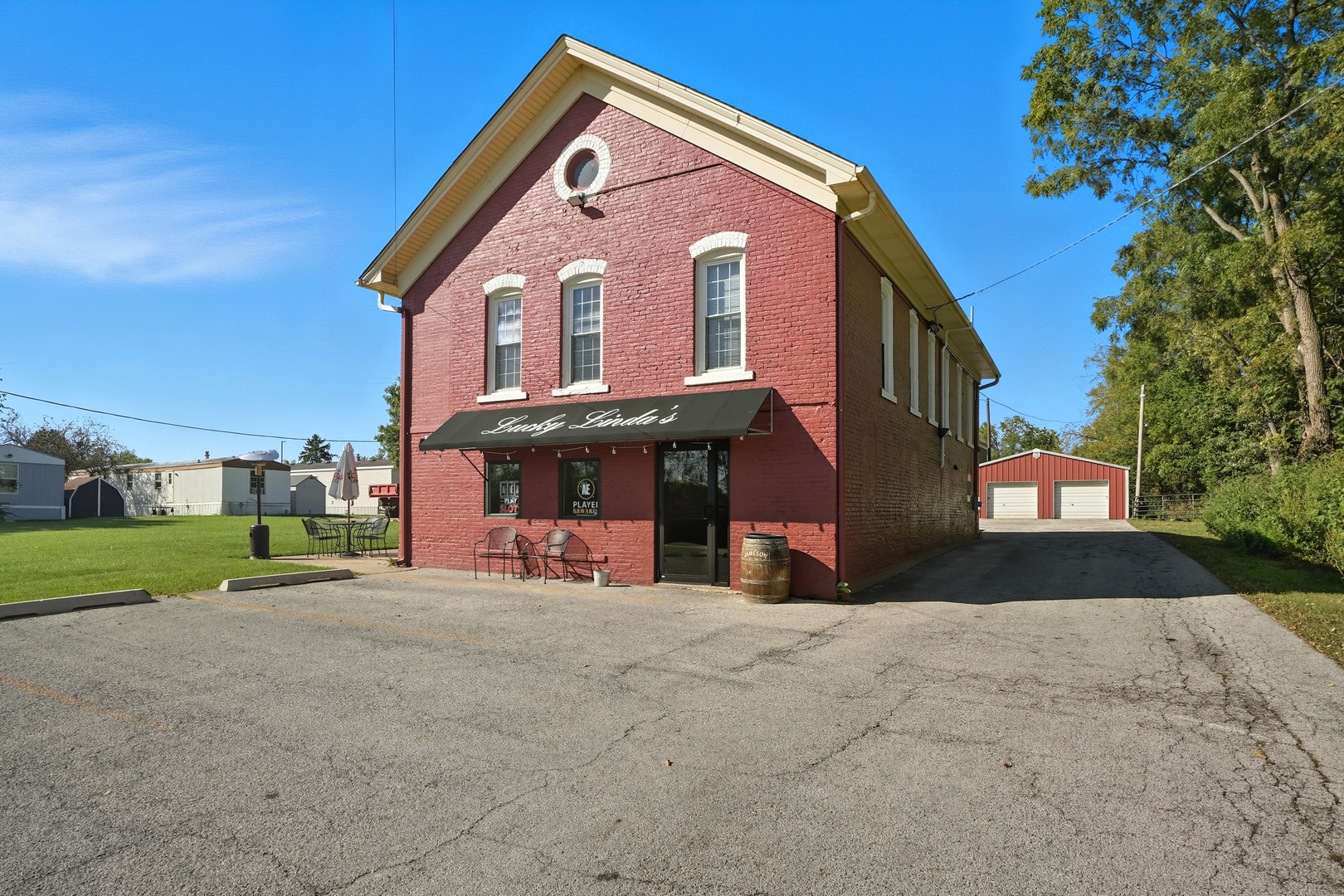 1702 South Dixie Highway Crete, IL 60417 - Photo 25 of 50 a view of a house with a yard and garage