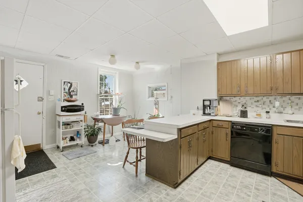 a kitchen with a sink stove and cabinets