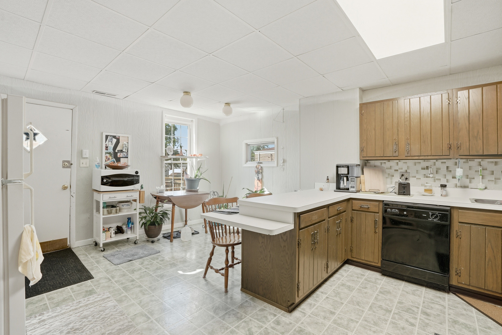 1702 South Dixie Highway Crete, IL 60417 - Photo 37 of 50 a kitchen with a sink stove and cabinets