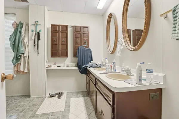a bathroom with a sink and a mirror