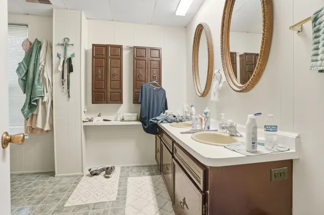 a bathroom with a sink and a mirror