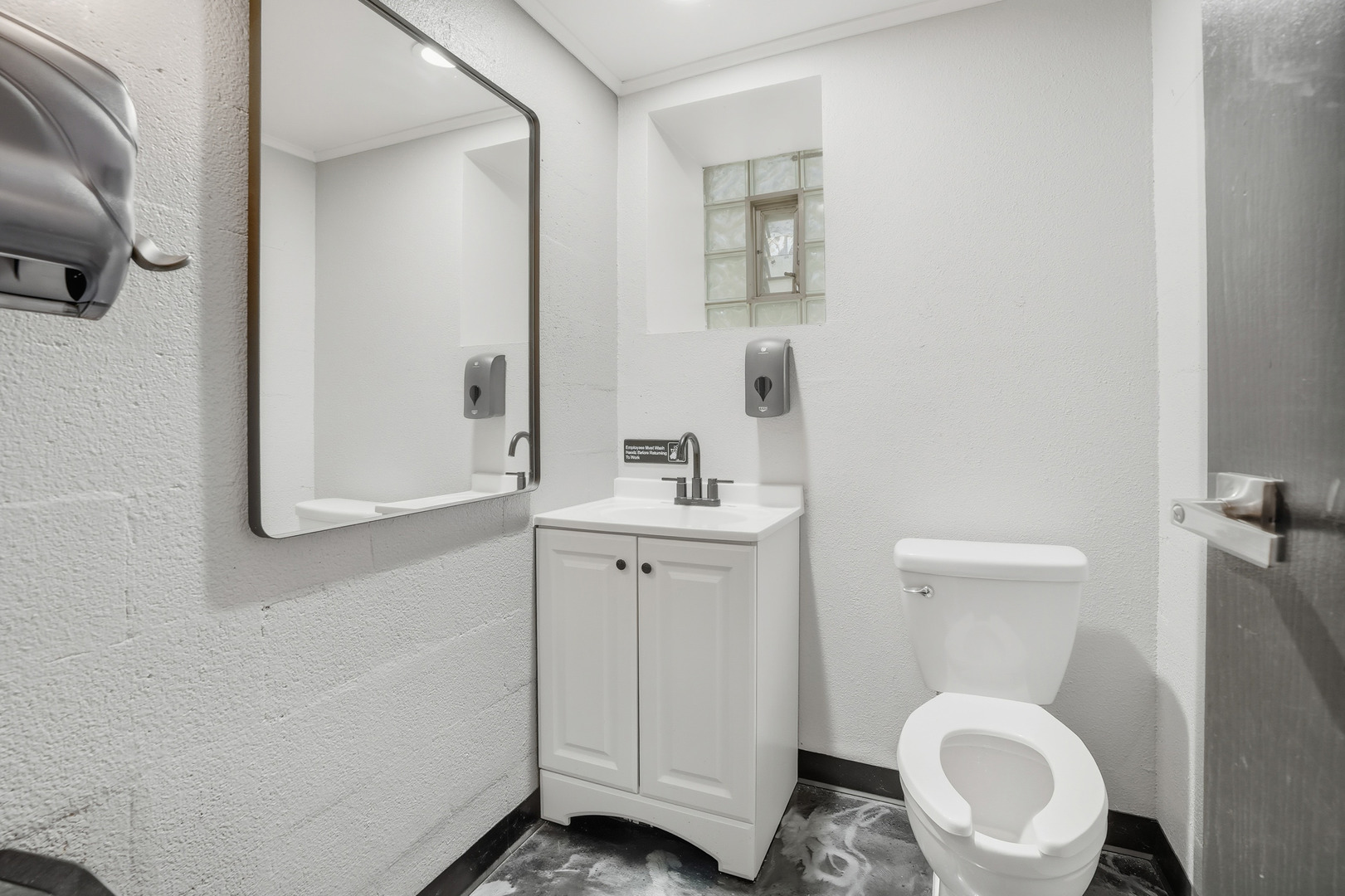 1702 South Dixie Highway Crete, IL 60417 - Photo 46 of 50 a bathroom with a toilet a sink and mirror