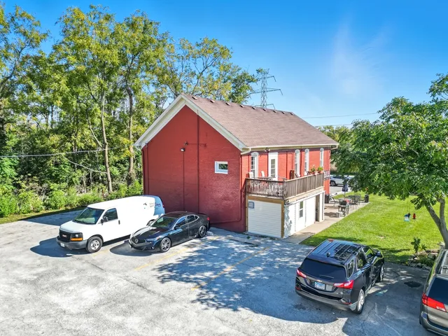 a car parked in front of a house with a yard