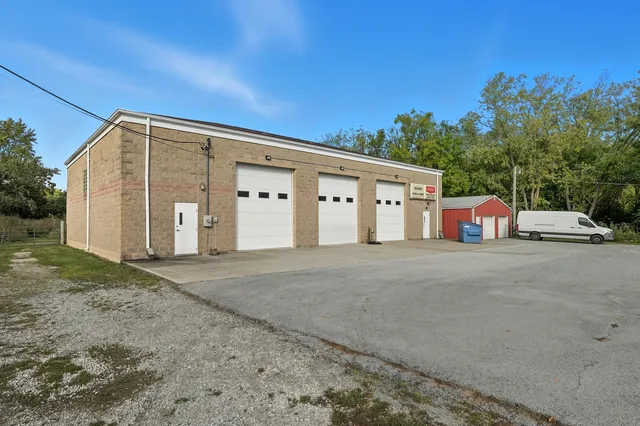 a backyard of a house with a yard and garage
