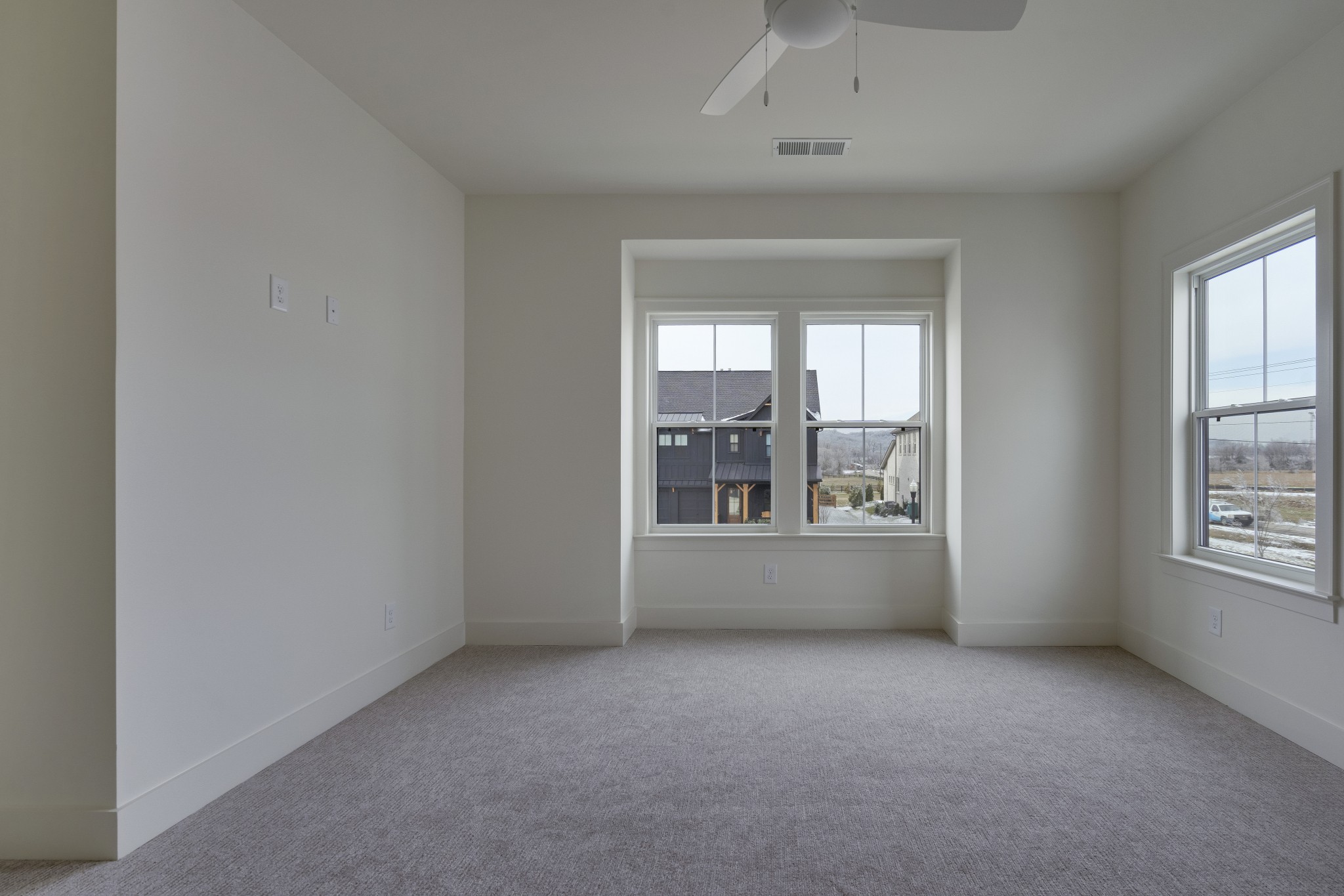 2004 Landry Place Franklin, TN 37064 - Photo 18 of 23 an empty room with a fireplace and windows