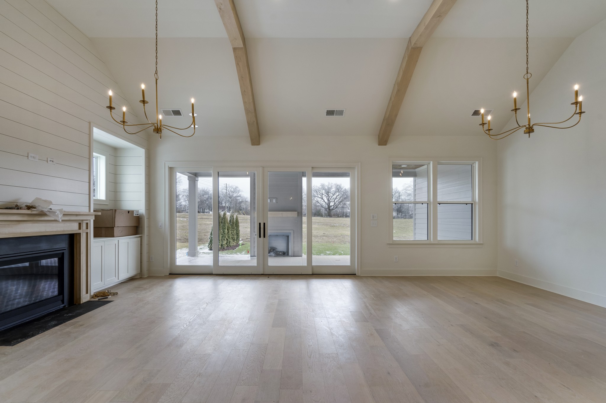 2004 Landry Place Franklin, TN 37064 - Photo 19 of 23 a view of an empty room with wooden floor and a fireplace