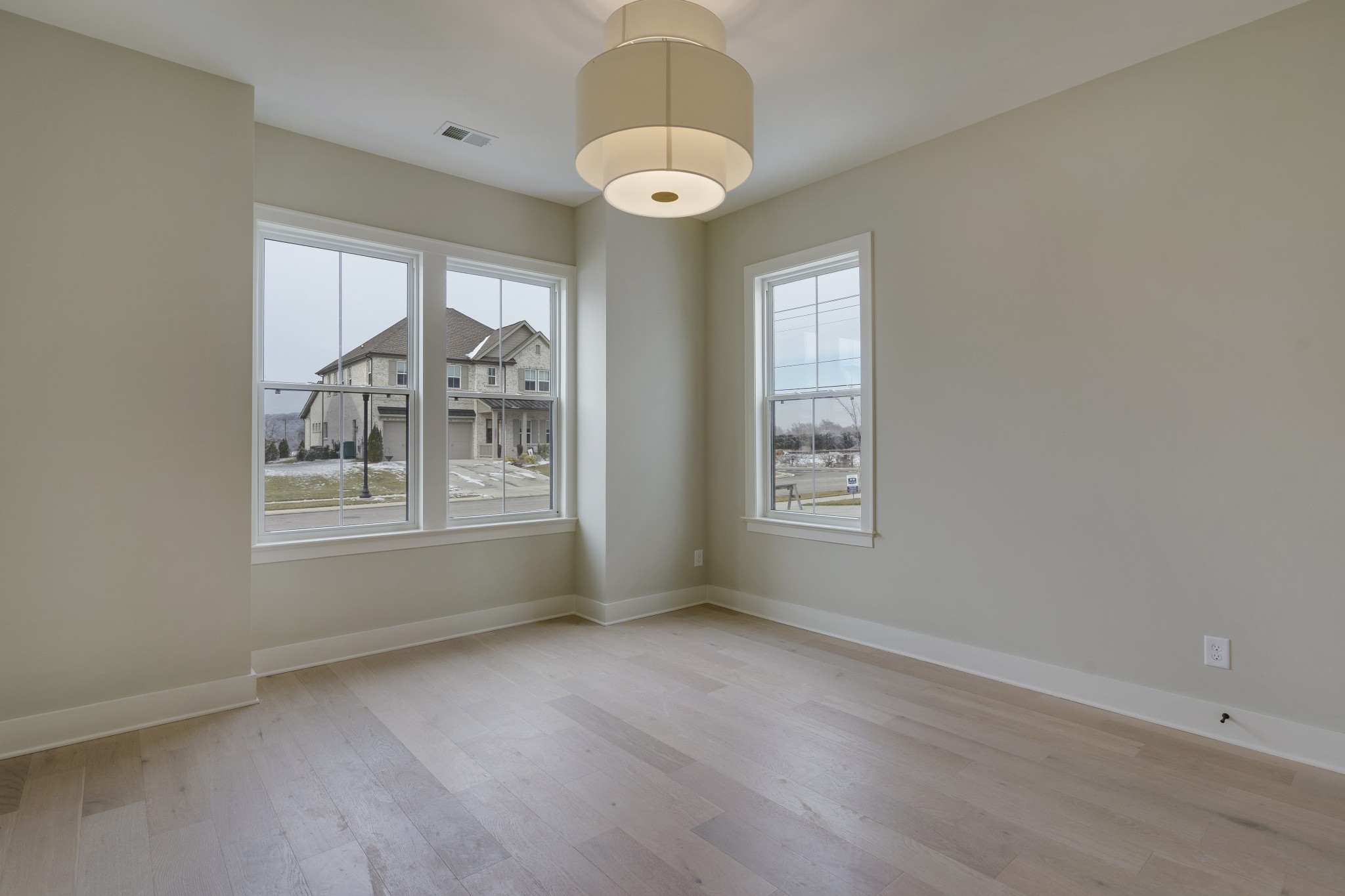 2004 Landry Place Franklin, TN 37064 - Photo 4 of 23 an empty room with wooden floor and windows