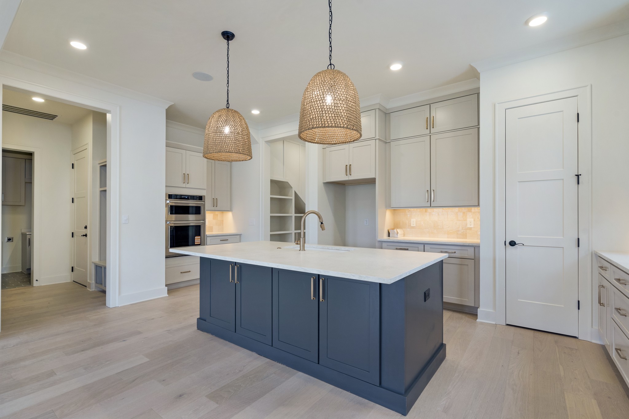 2004 Landry Place Franklin, TN 37064 - Photo 6 of 23 a kitchen with a sink chandelier and a stove