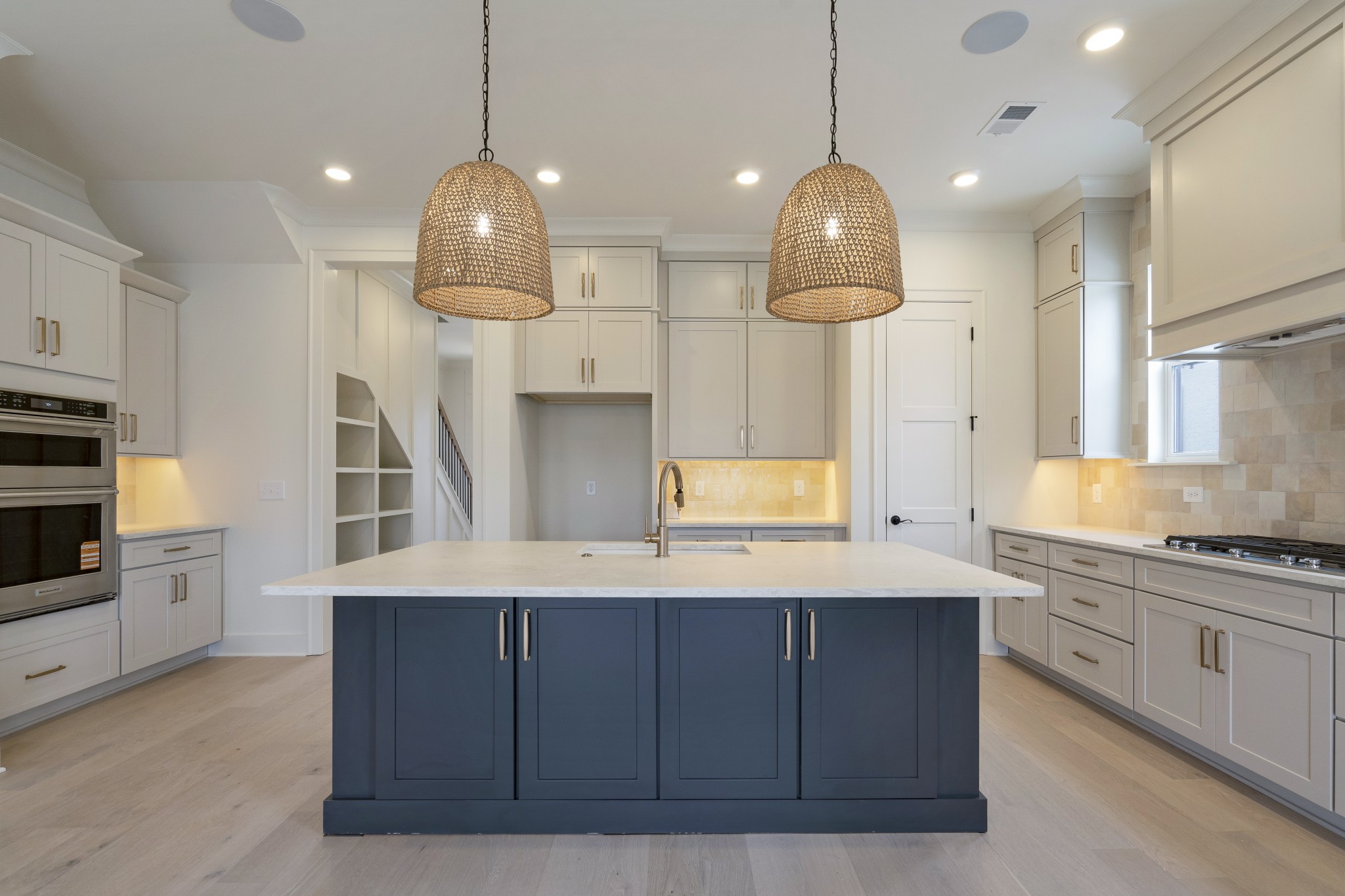 2004 Landry Place Franklin, TN 37064 - Photo 7 of 23 a kitchen with kitchen island granite countertop a sink a counter space appliances and cabinets