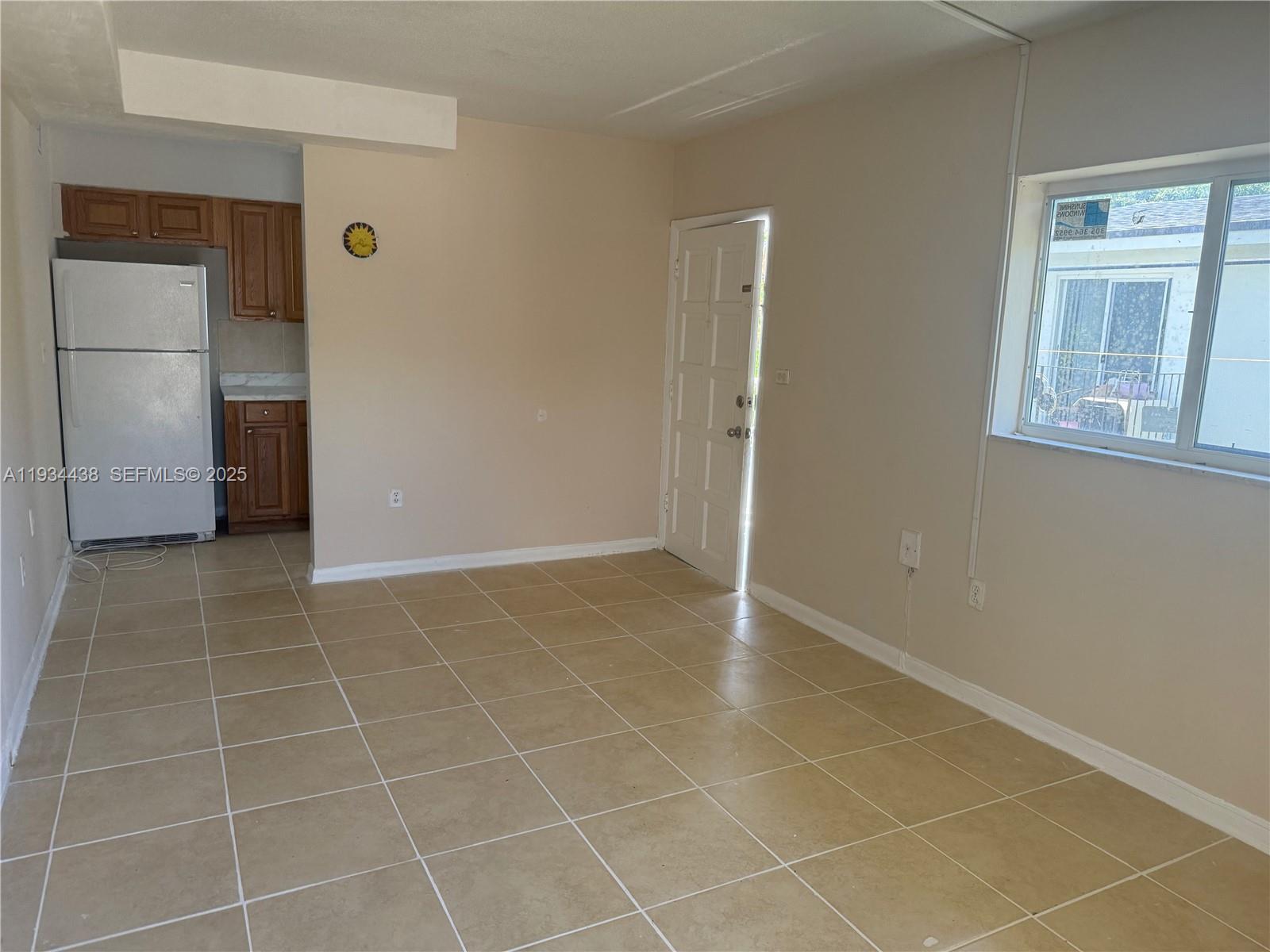 621 Southwest 15th Avenue, Unit 4 Miami, FL 33135 - Photo 7 of 15 a view of an empty room with a window