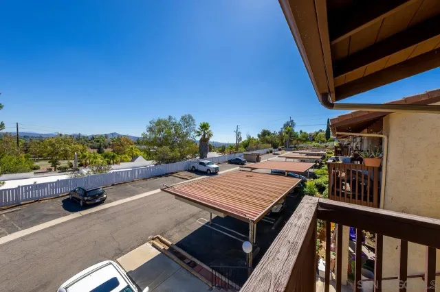 a view of a balcony with furniture