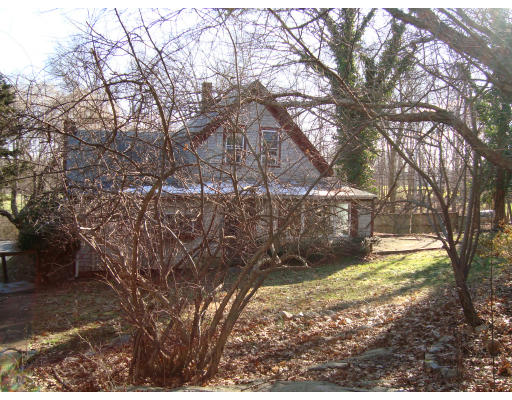 92 Gannett Road Scituate, MA 02066 - Photo 7 of 7 a view of yard with trees in the background