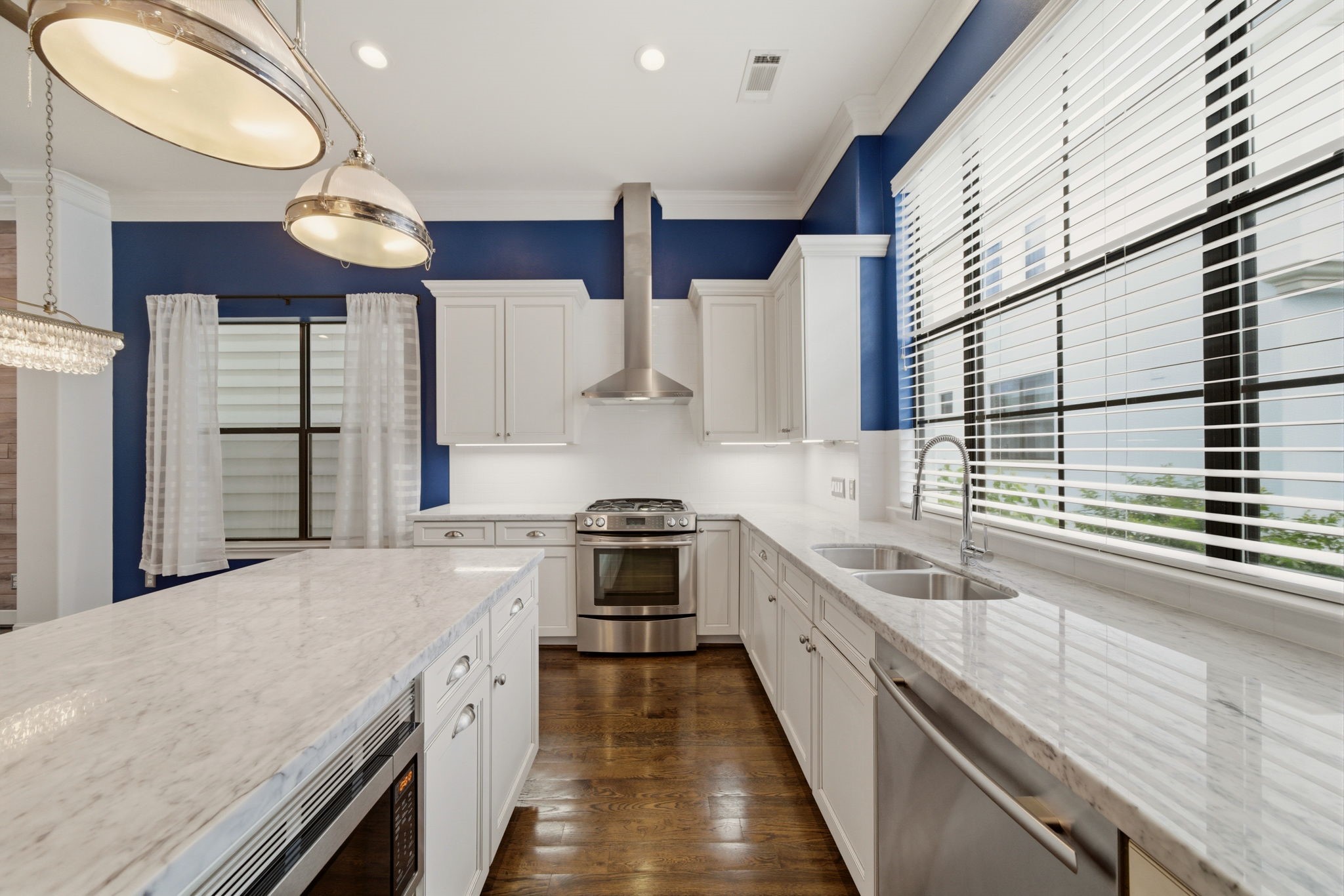911 West Drew Street Houston, TX 77006 - Photo 17 of 44 a large kitchen with stainless steel appliances granite countertop a stove a sink and a refrigerator