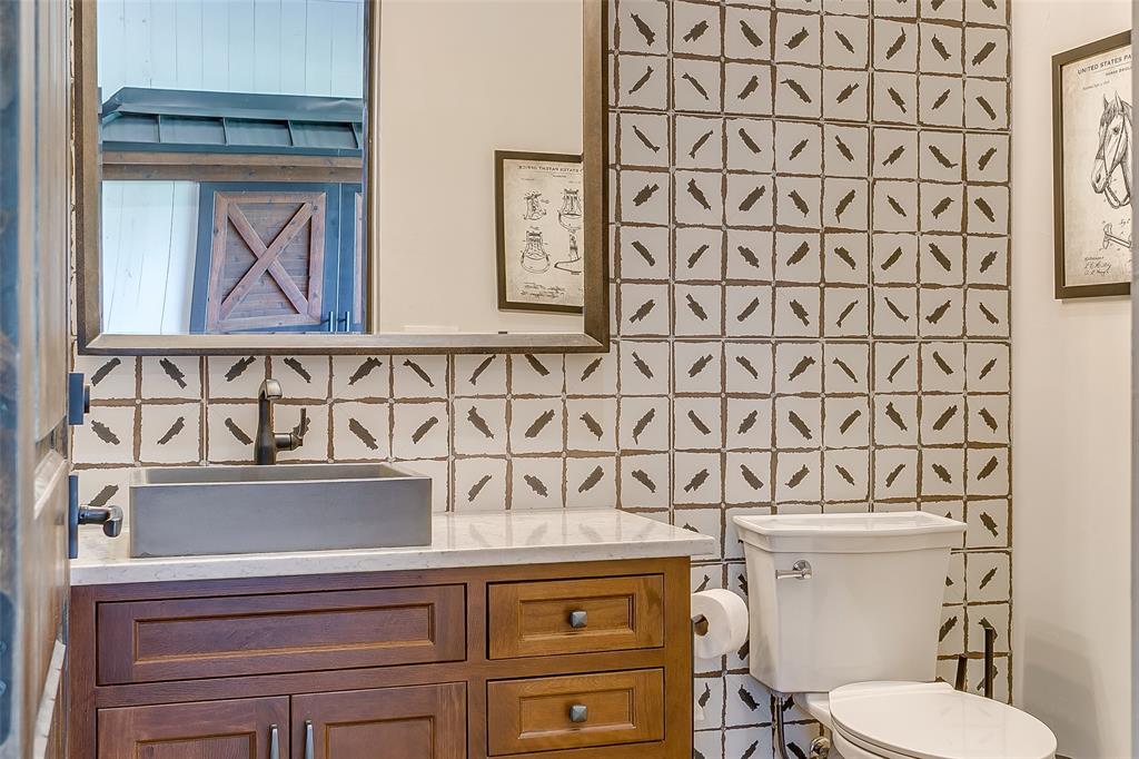 5000 T W King Road Southlake, TX 76092 - Photo 20 of 40 Half bathroom located in the barn alley, just across from the custom jockey-style locker room — convenient and thoughtfully designed for daily use.