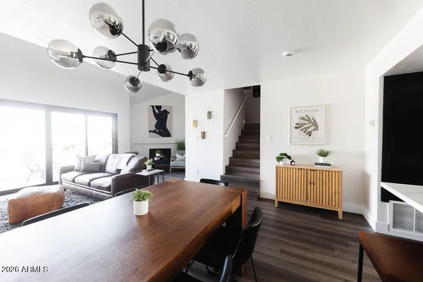 a living room with fireplace furniture and a flat screen tv