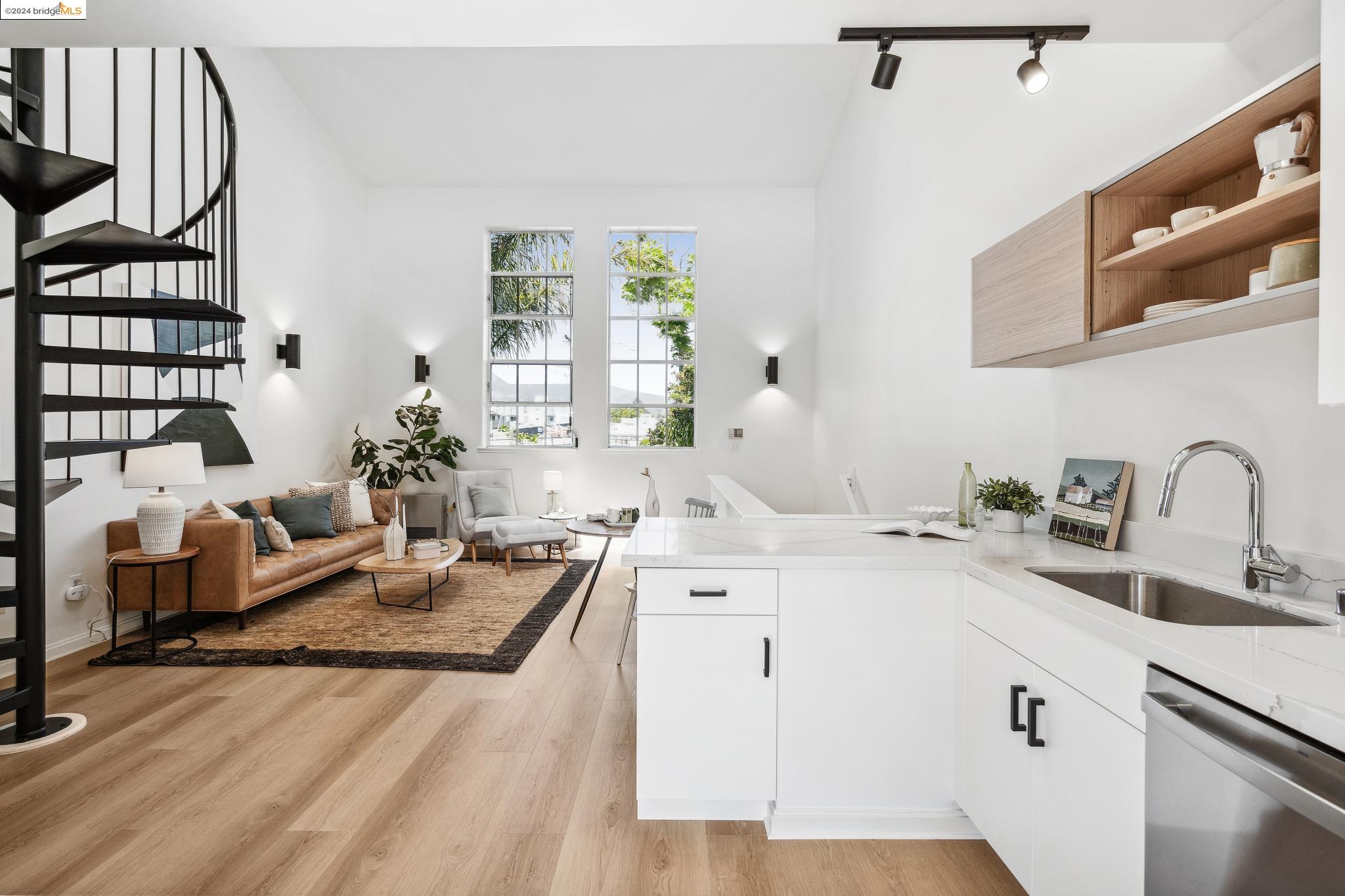 a spacious en suite bathroom with a double vanity sink and a mirror